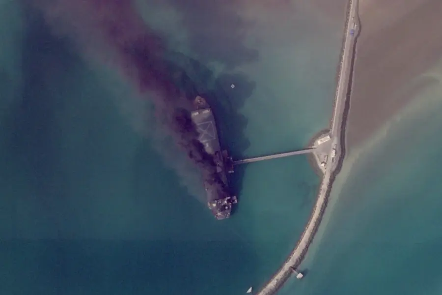 A ship in an Iranian port burns after a U.S. strike.